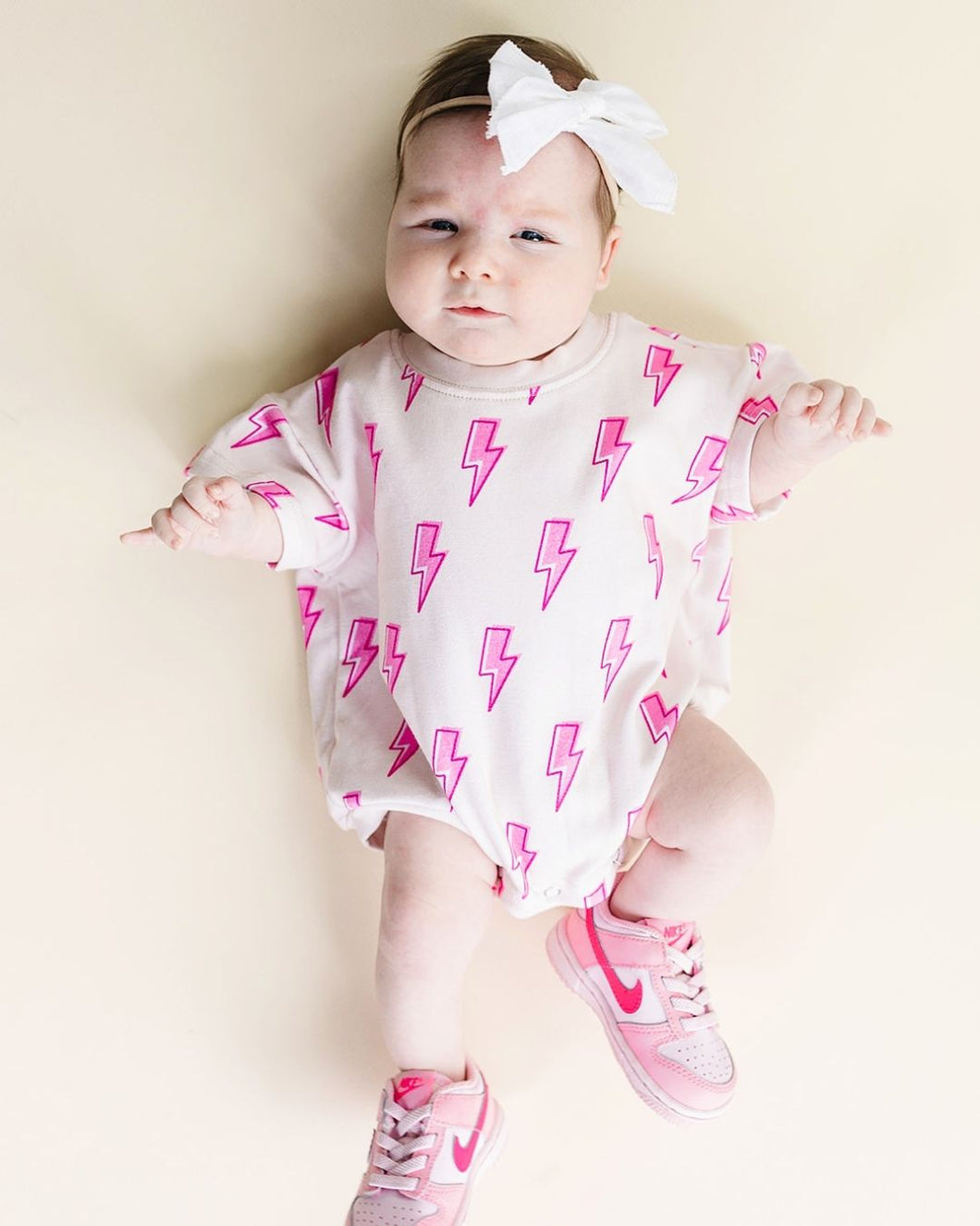 Short Sleeve Bubble Romper | Pink Bolts (LPK)